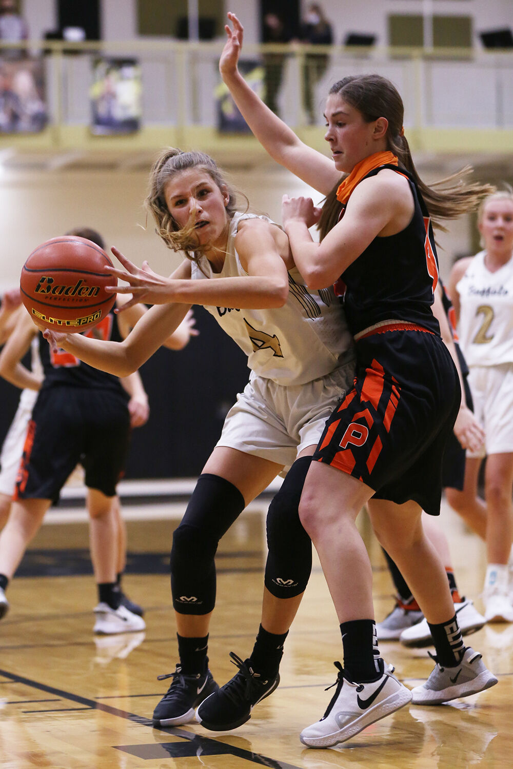 Lexi Rule stretches to receive a pass before turning and shooting